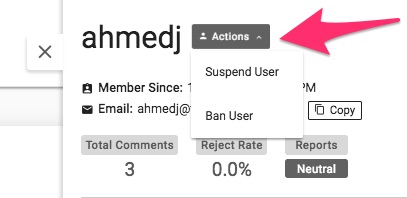 A close up of the User Drawer with a large pink arrow indicating the Actions menu where users can be suspended or banned