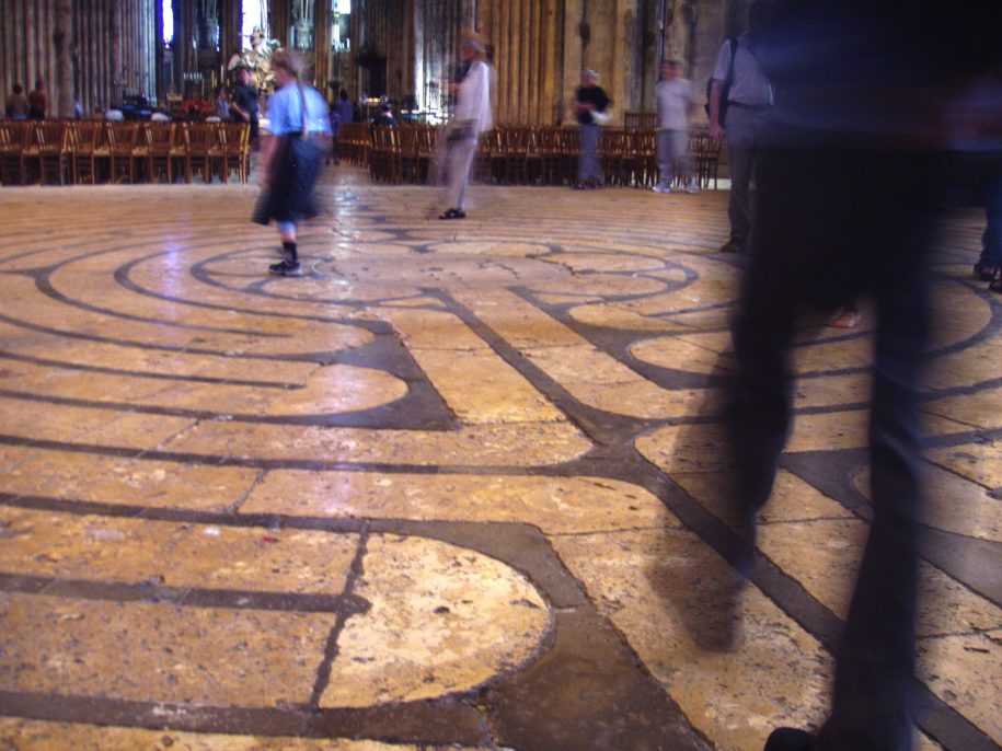 [IMAGE] Labyrinth at Chartres Cathedral. Visitors walking on an inlaid stone labyrinth